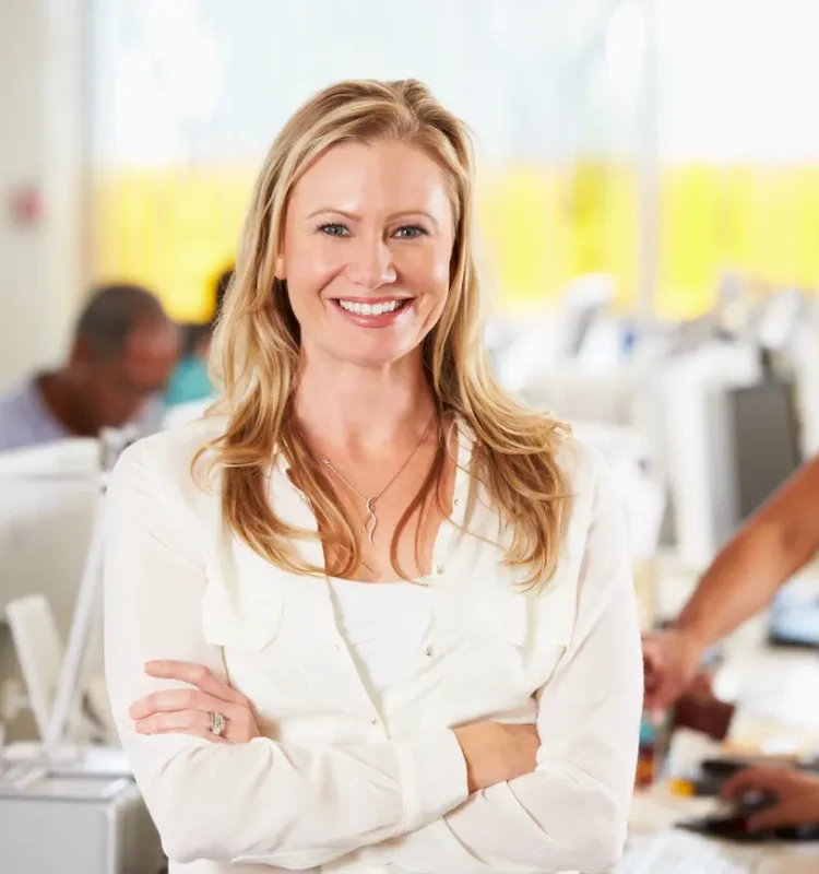 portrait-of-woman-standing-in-busy-creative-office-2024-10-19-11-52-17-utc